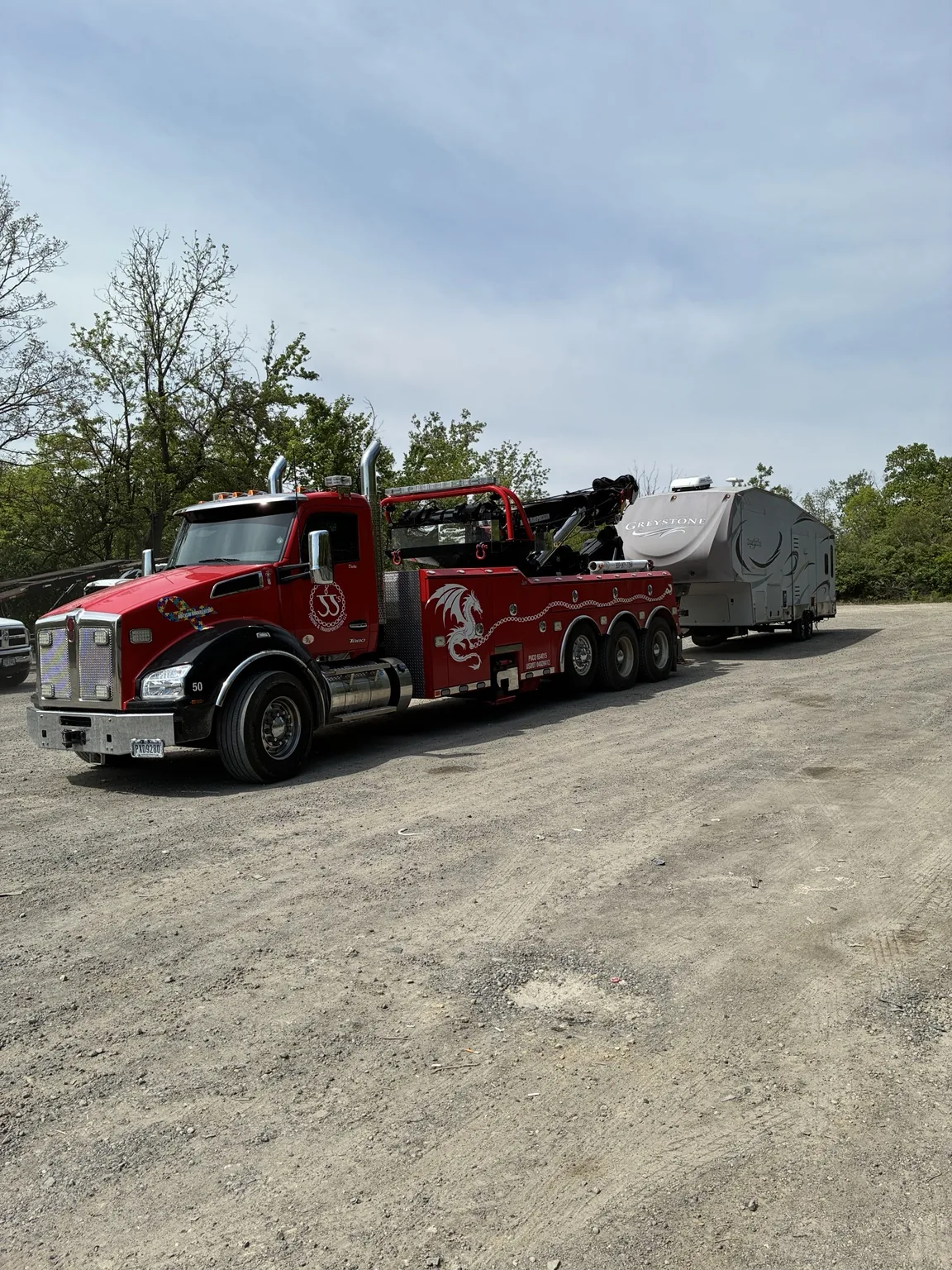 JJ’s heavy wrecker transporting equipment