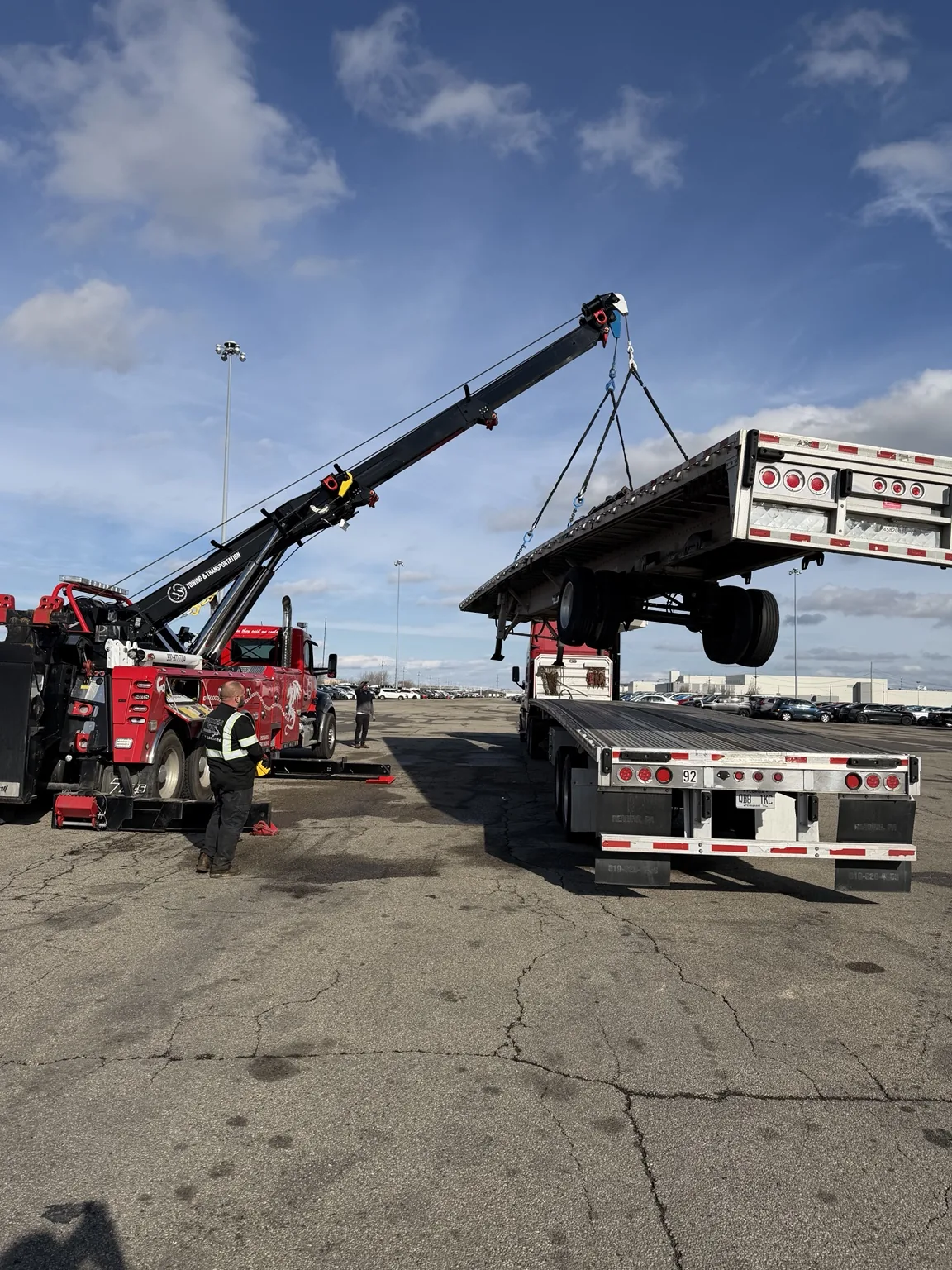 JJ’s rotator lifting a commercial trailer