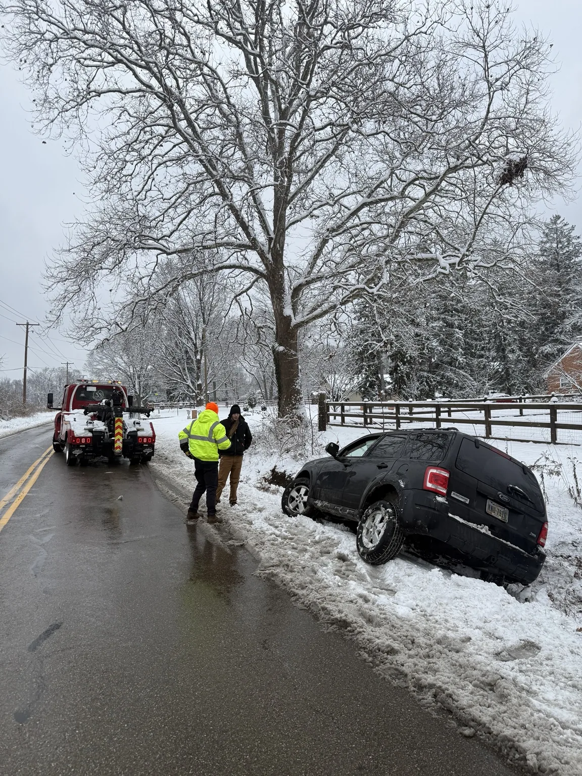 JJ’s crew recovering a vehicle in snowy conditions