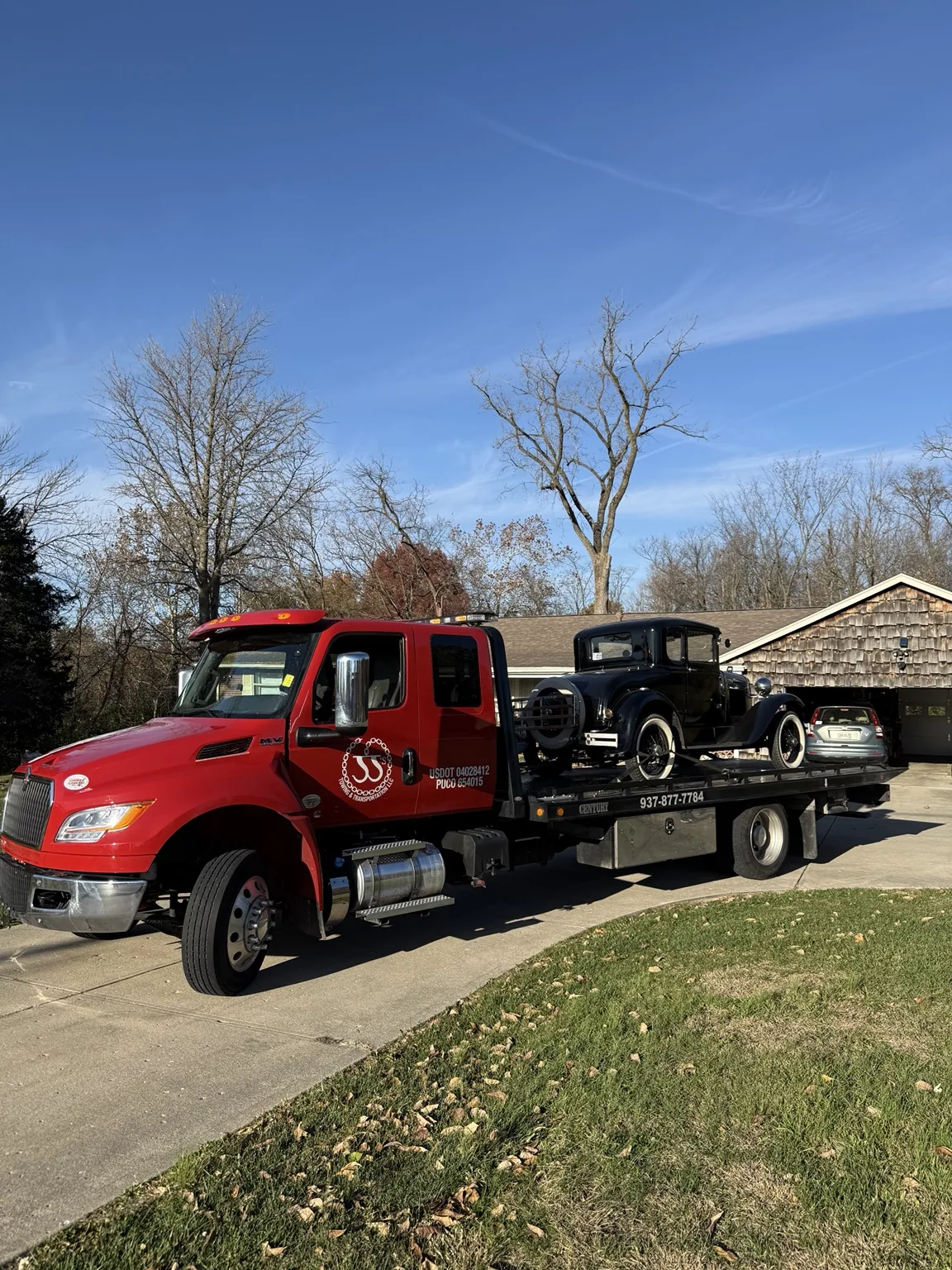 JJ’s tow truck moving a utility vehicle
