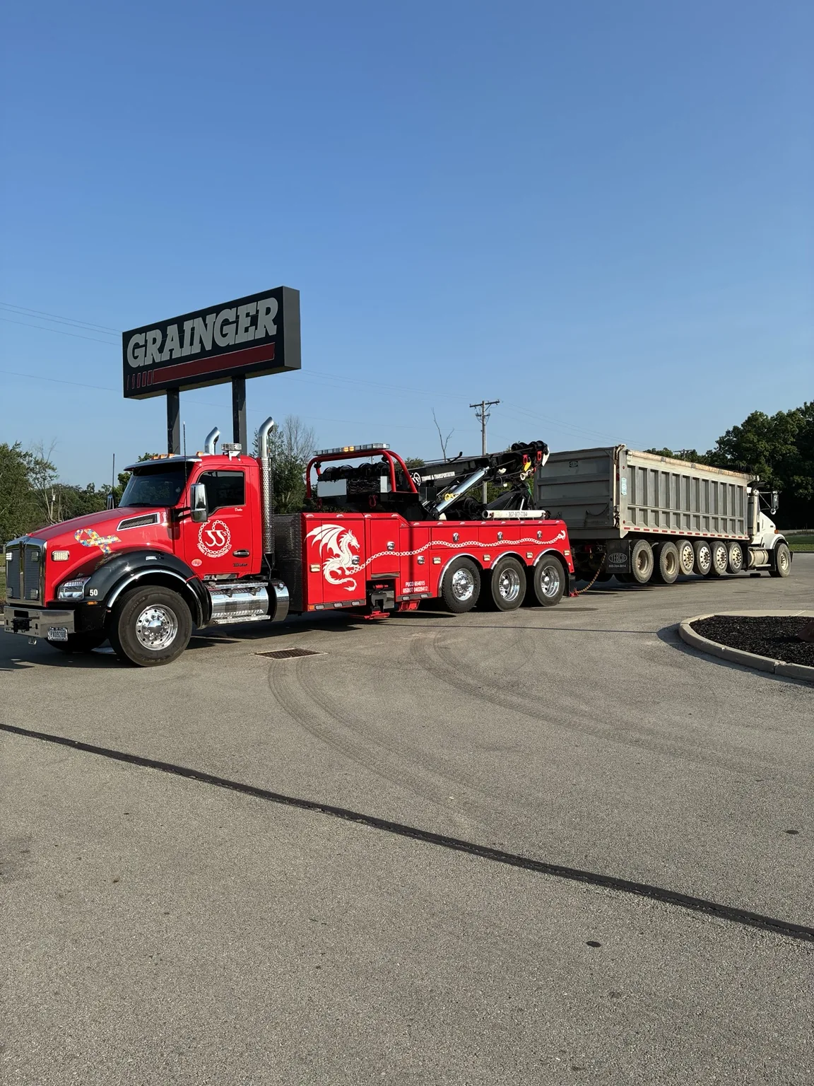JJ’s heavy wrecker with a dump truck