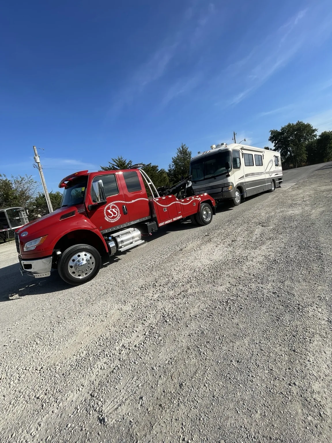 JJ’s wrecker towing a large vehicle