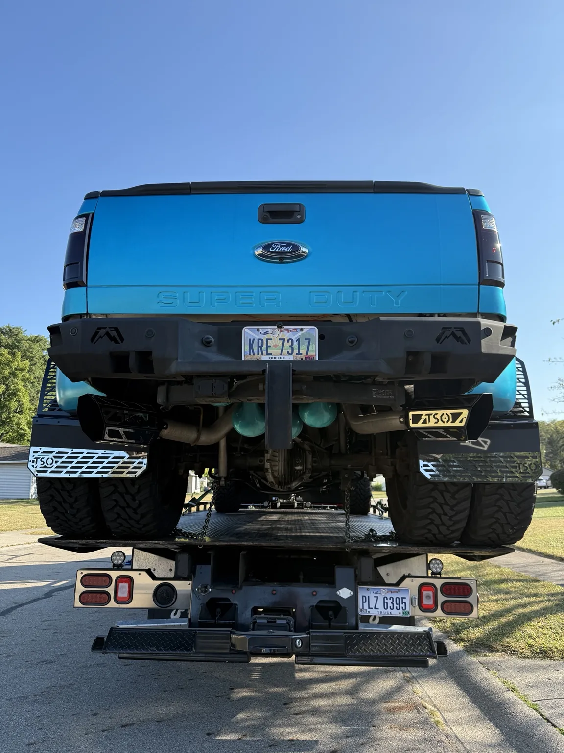 A large blue pickup on JJ’s flatbed