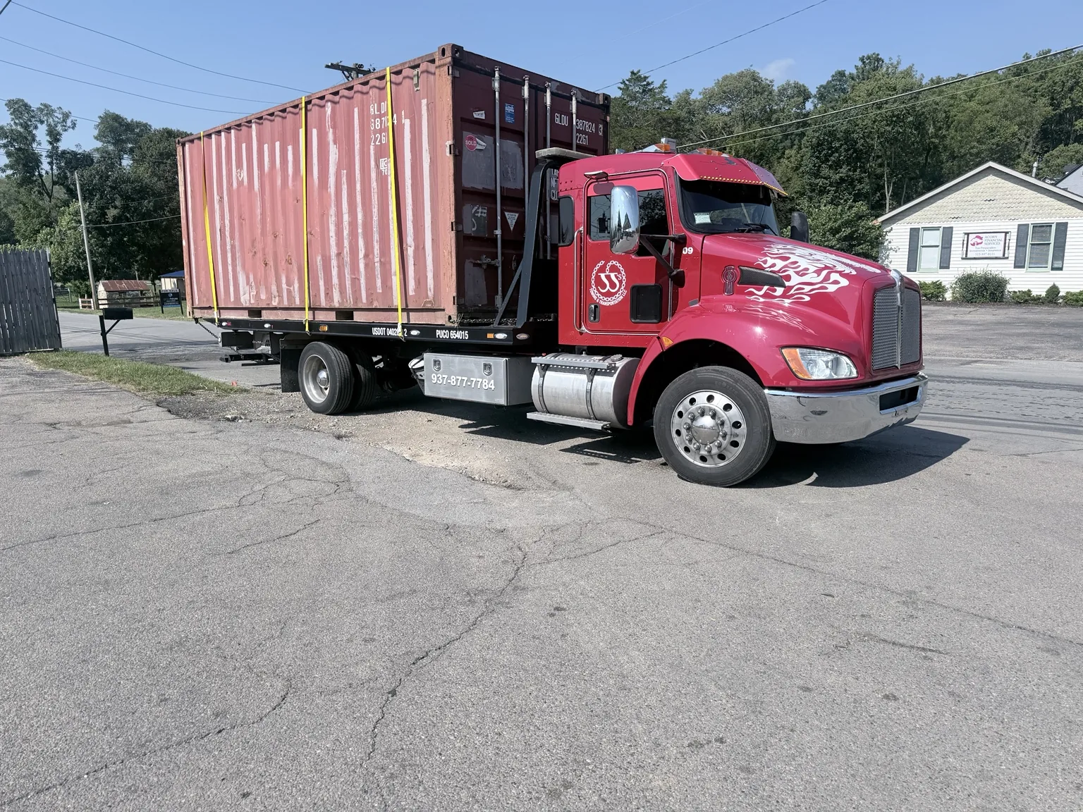 JJ’s medium duty truck moving a container